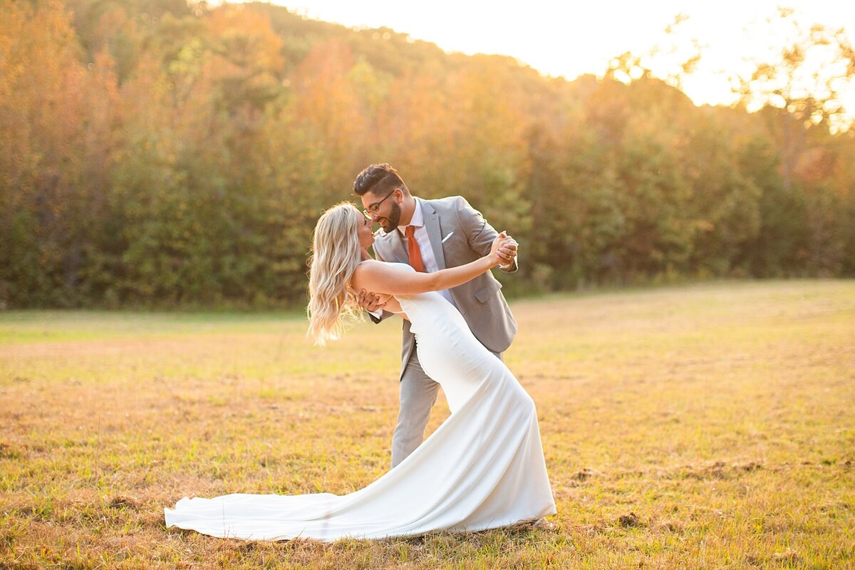 Greenville  Wedding Photographer, couple dancing in a field