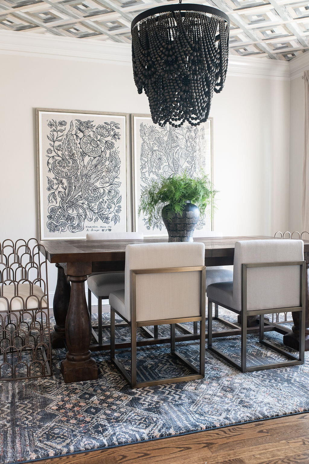 a dining room decorated with a black, white and brown color scheme