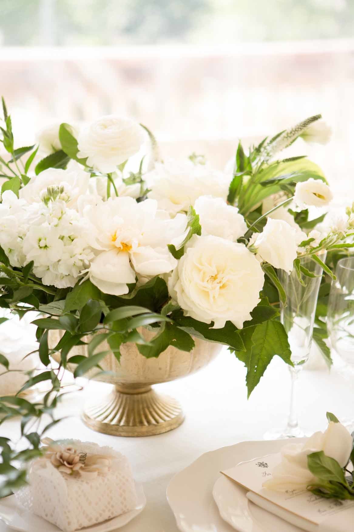 Gold compote wedding centerpiece with white peony's and garden roses