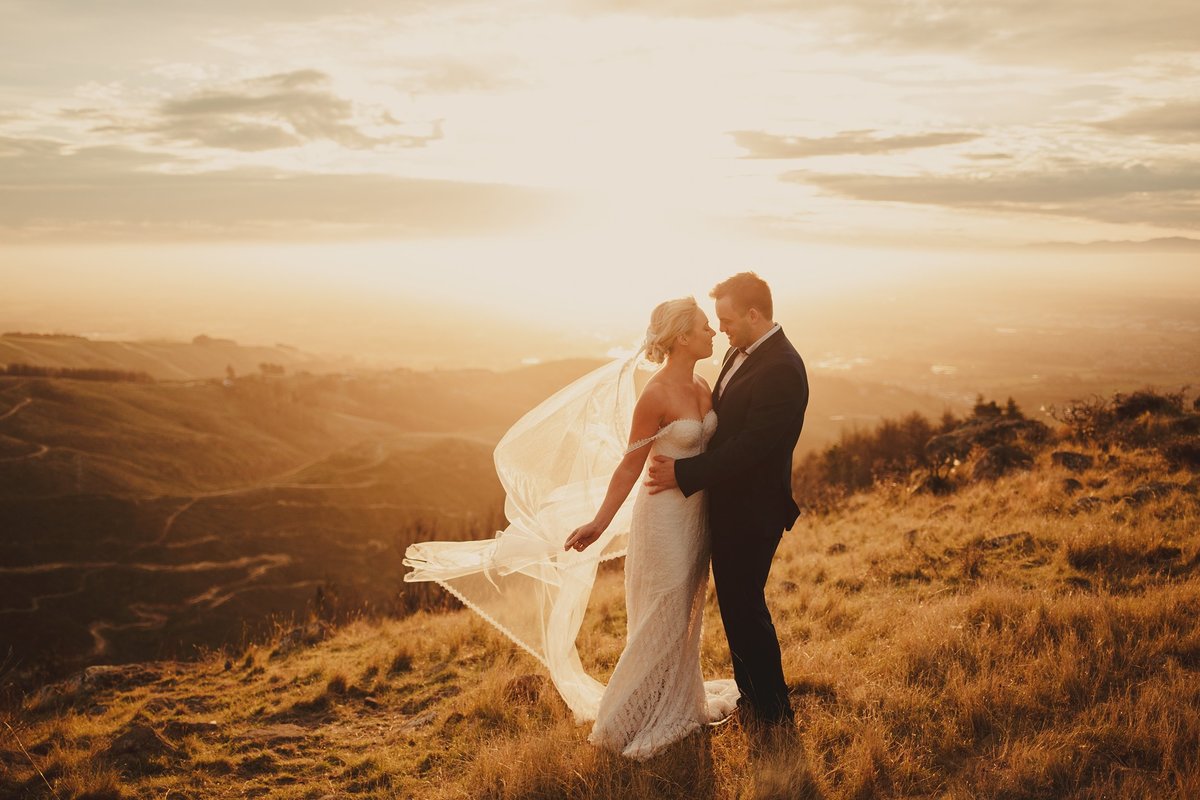 Bride and Groom in the golden sunset on Port Hills