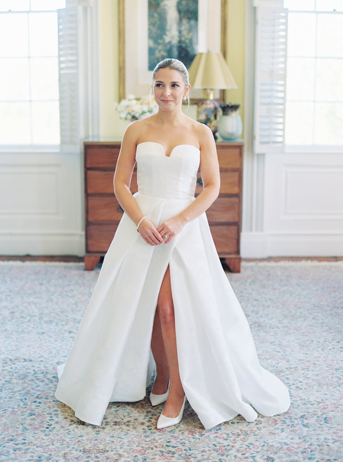 Film bridal portraits at Thomas Bennett House. Yellow room. Wedding dress with slit in the front.