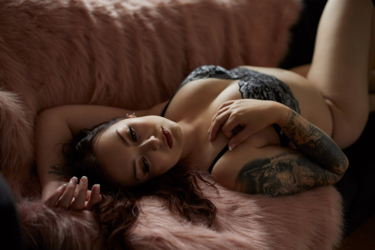 Woman wearing lingerie, laying on couch