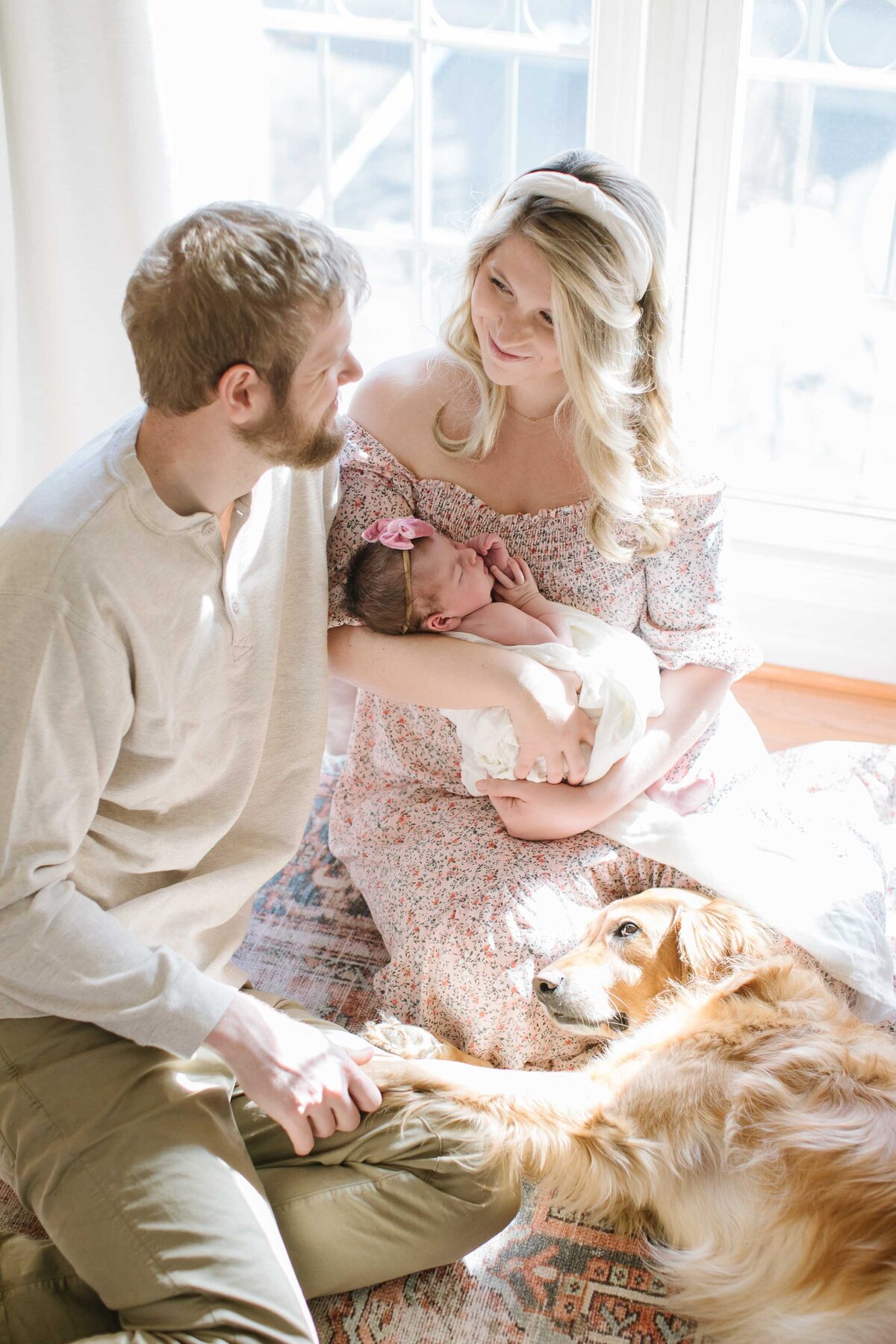 mom and dad holding newborn during photo session in northern virginia
