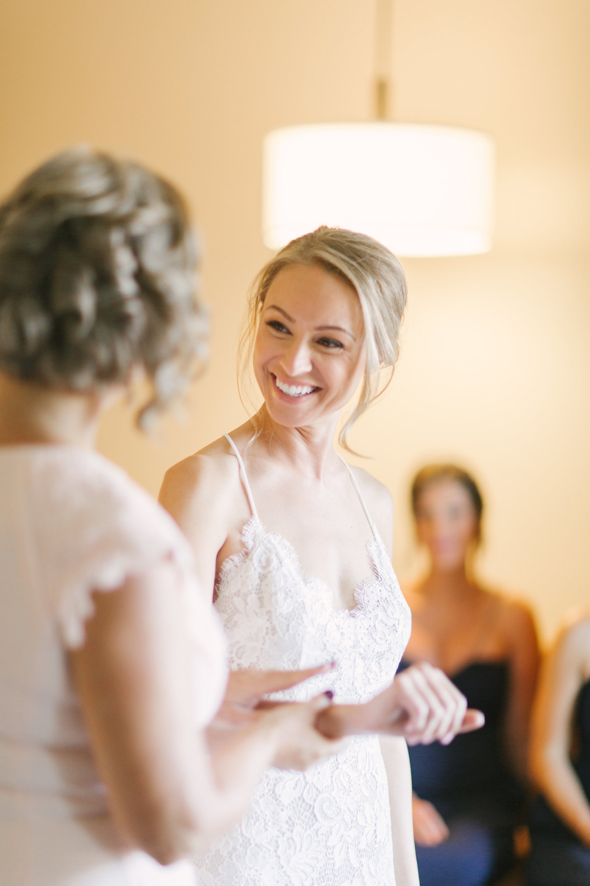 Mother of the bride looks at daughter prior to Firestone Winery Wedding