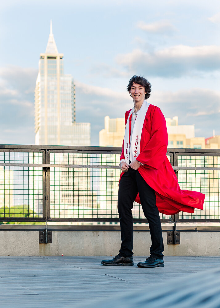 Cap and Gown photo session on a rooftop with city view  at downtown Raleigh, NC