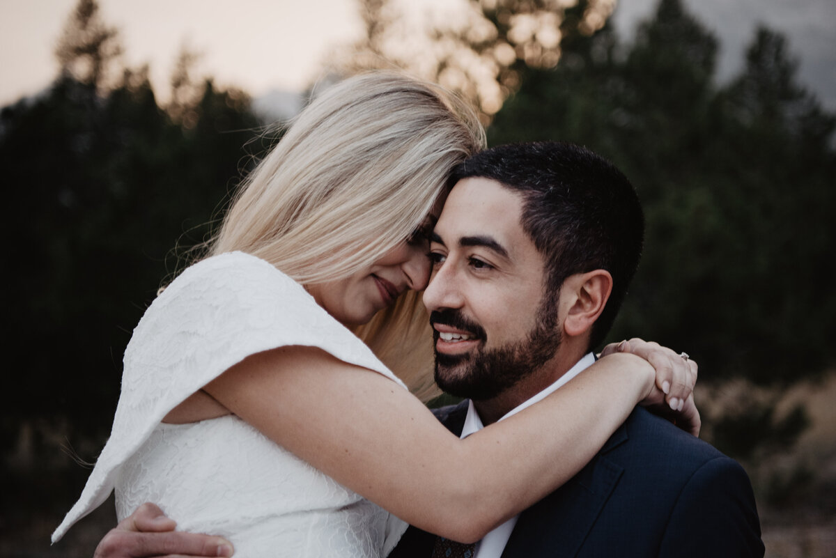 Photographers Jackson Hole capture groom smiling with bride