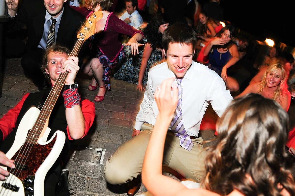 fun on dance floor during wedding at west shore cafe in lake tahoe with Notorious Rocks