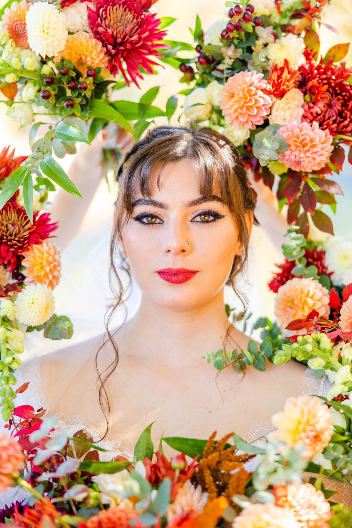 portrait of bride surrounded by flowers