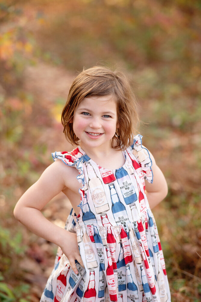 Family session of little girl wearing a dress