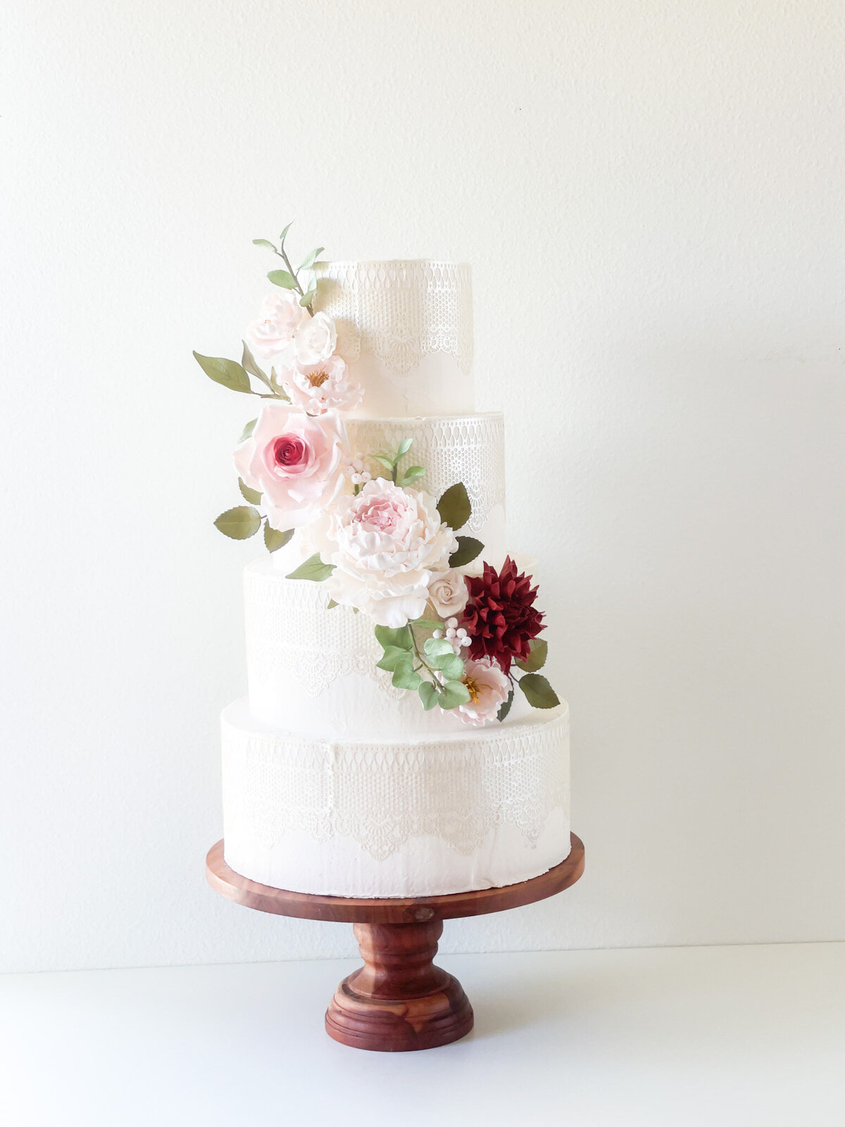 sugar-flower-cascade-on-four-tier-cake-with-dusty-pink-and-burgundy-roses-dahlias-peonies-sugar-flowers