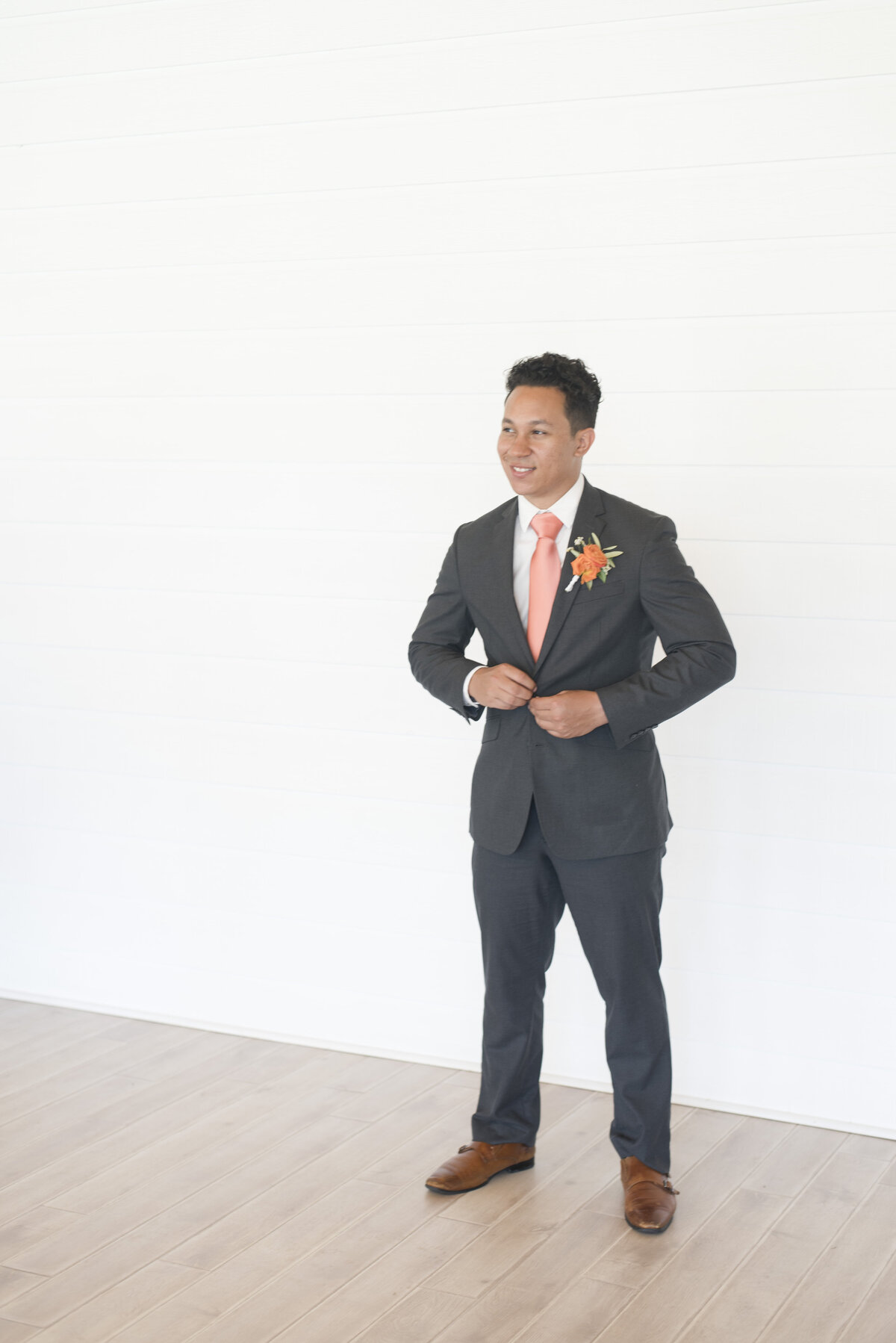 Groom standing for wedding photos for Fort Worth wedding