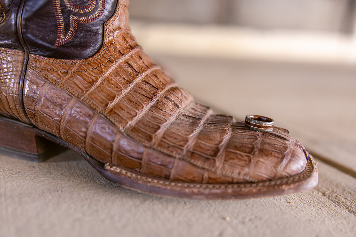 groom's ring on alligator cowboy boot detail at Texas wedding