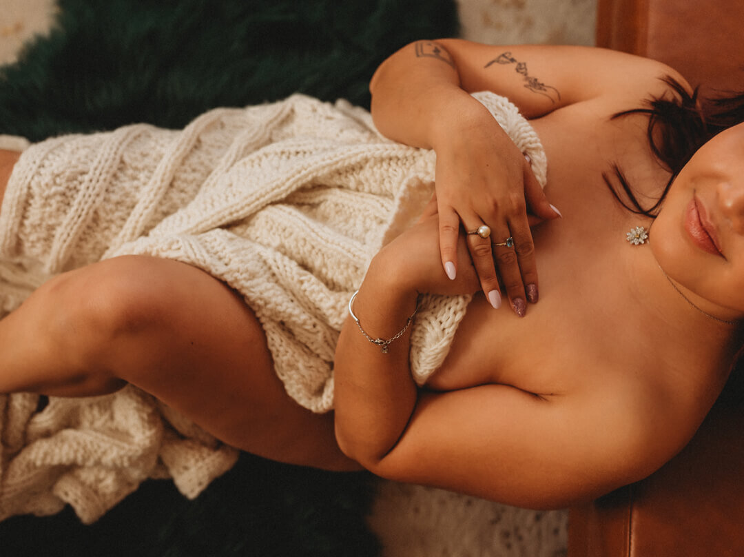Cozy blanket boudoir session at Limitless Boudoir