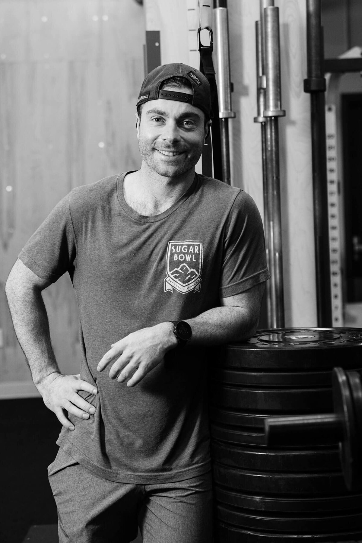 head trainer in gym black and white image at SugarBowl academy