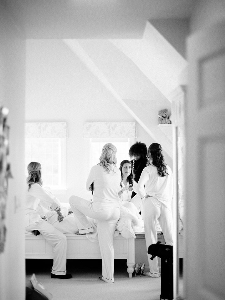 black and white photo of bride getting ready