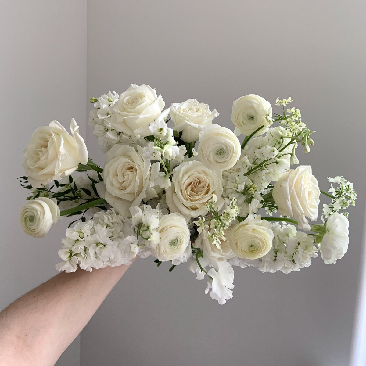 White, feminine, garden style wedding flower bouquet.