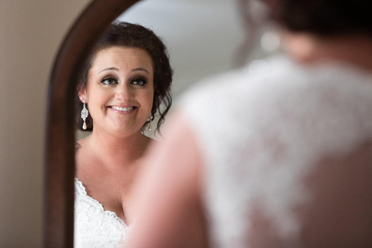 Bride seeing herself in her wedding dress