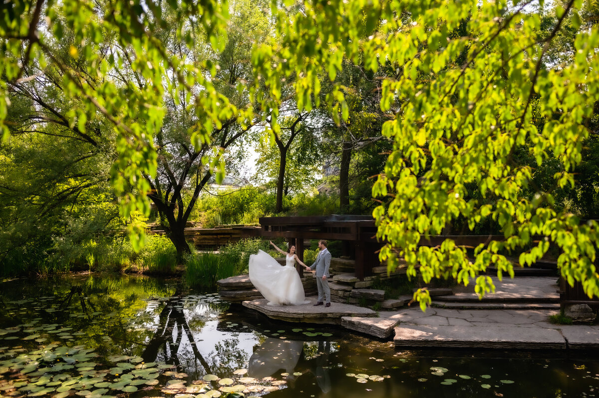 Bride and groom dance at the Alfred Caldwell Lily Pool