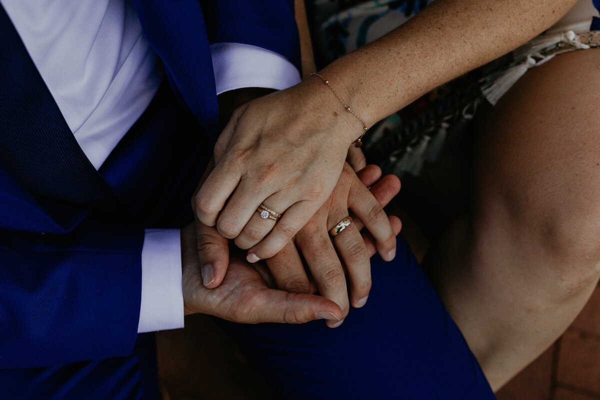 newlyweds hands together with their wedding rings