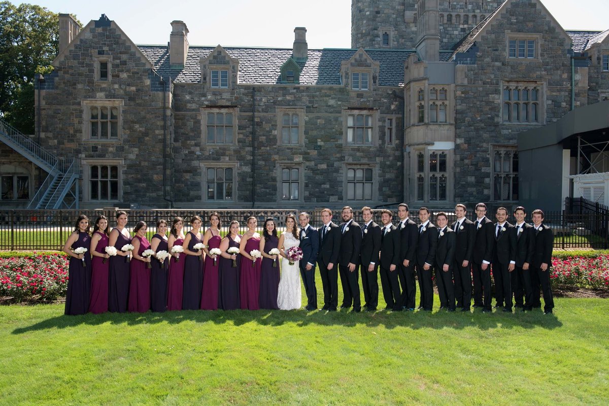 Bridal party standing in front of Hempstead House