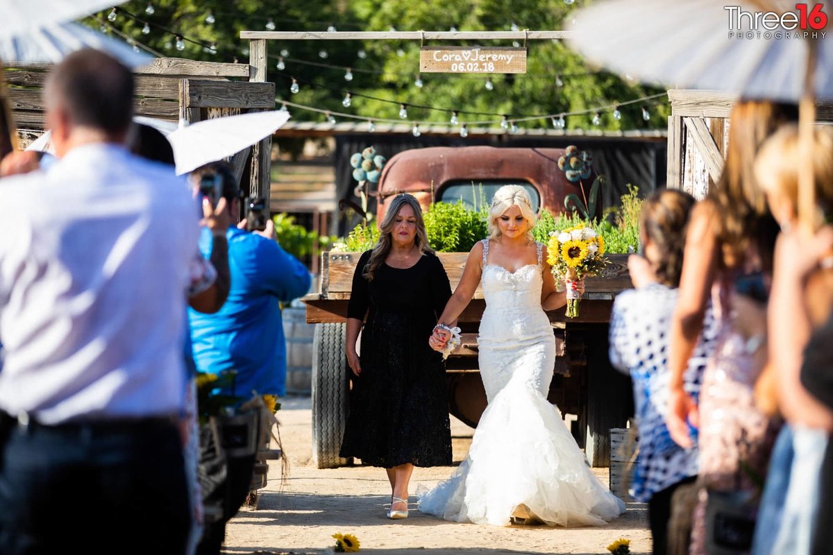 Mother of Bride walks her daughter down the aisle