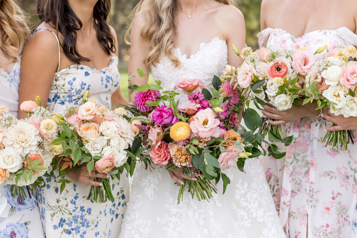Bridal Party and Bride in Printed Dresses with Flowers