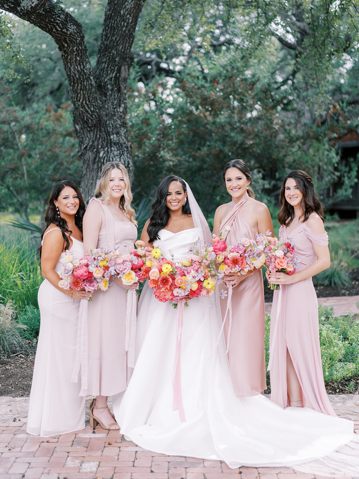 pink-bridesmaid-dresses-with-colorful-flowers