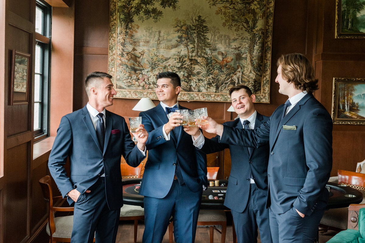 Groomsmen toasting on the groom