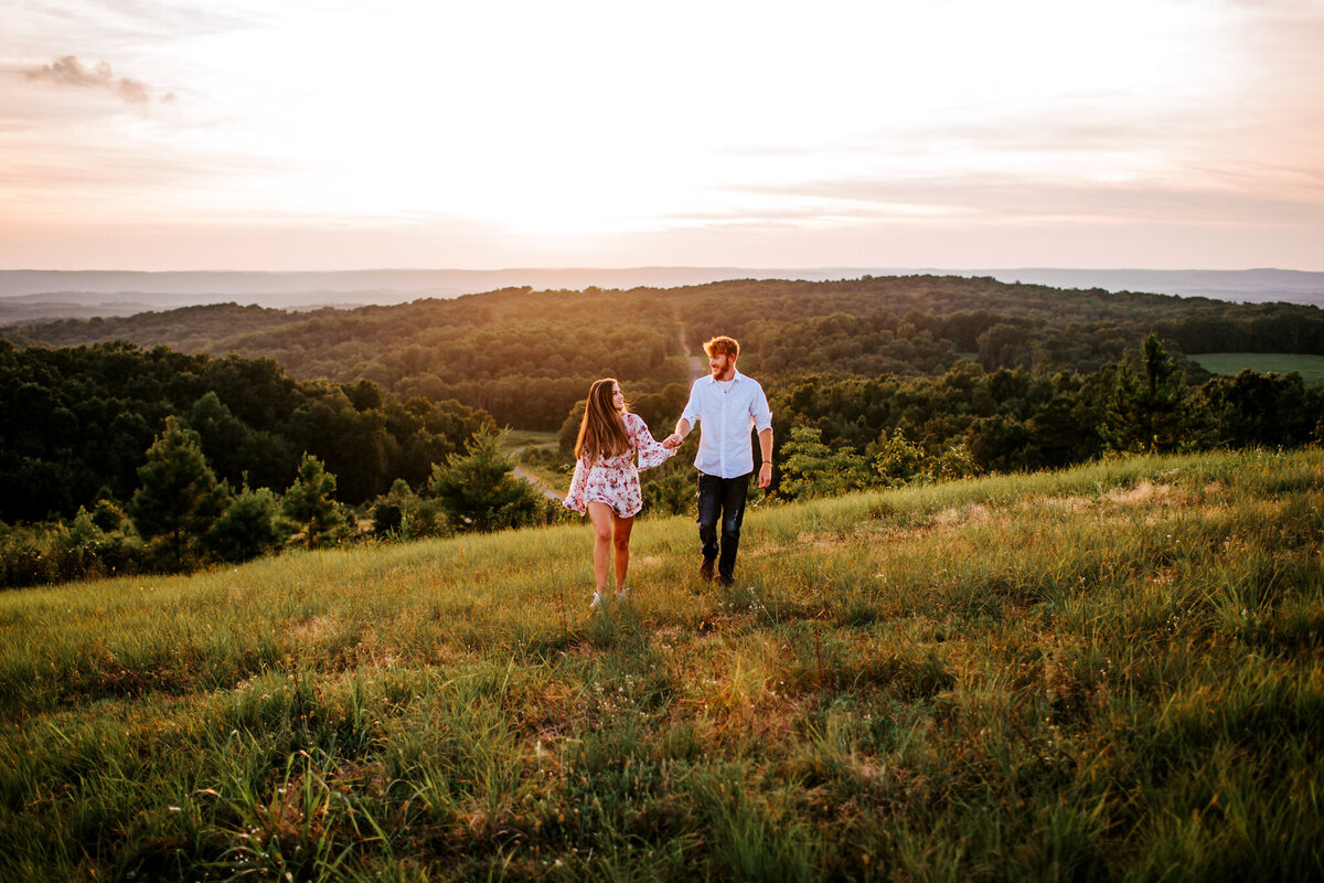 photo of Allie and her husband walking in a field