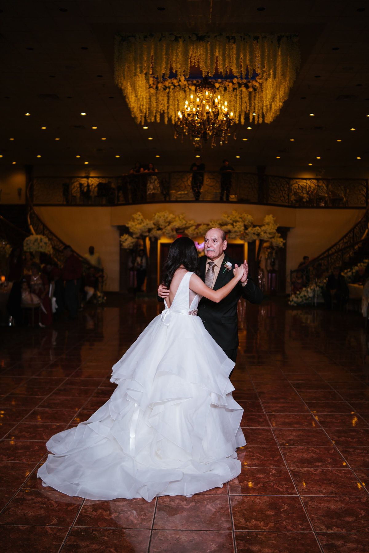 father dances with daughter during wedding reception at The Emporium by Yarlen venue in San Antonio