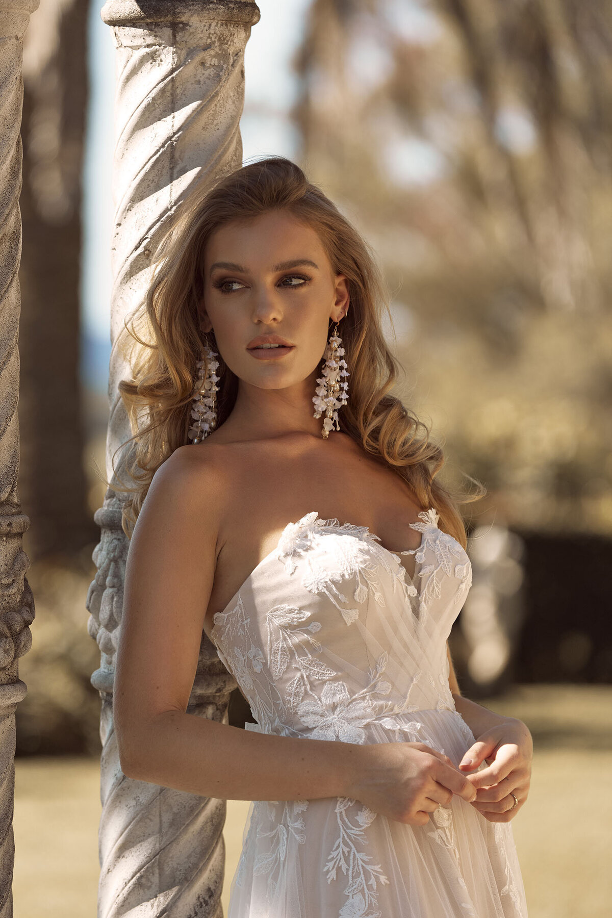 BRIELLE ML19255 FULL LENGTH A-LINE SILHOUETTE PLUNGING NECKLINE EMBROIDERED FLORAL LACE WITH DETACHABLE SHOULDER STRAPS AND TULLE CROSS OVER STRAPS FINISH WEDDING DRESS MADI LANE BRIDAL 6