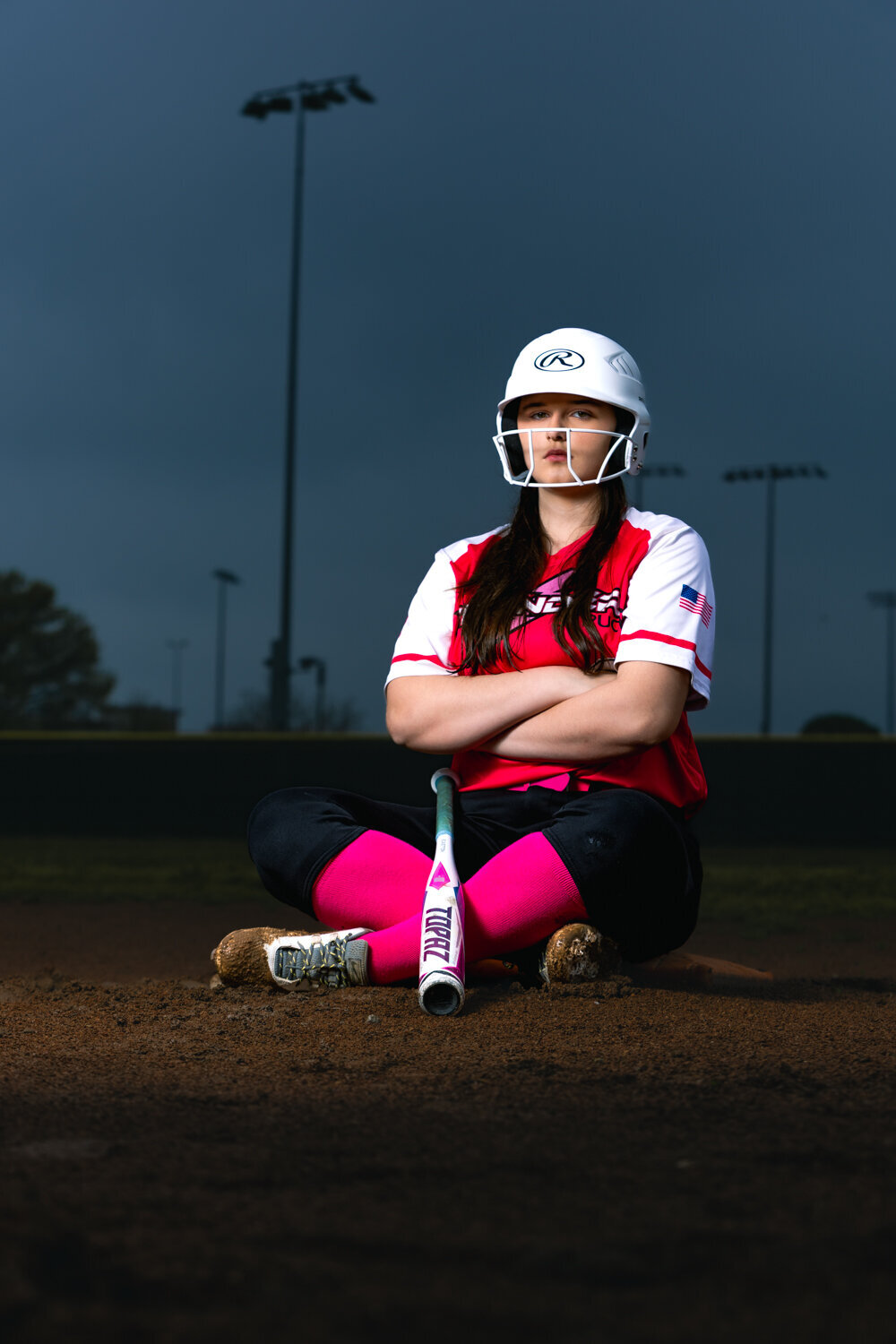 Dramatic creative powerpose senior session softball portraits in Lansing Michigan
