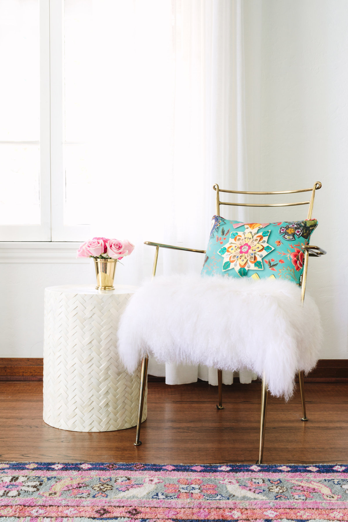 Gold chair with Mongolian lamb fluffy seat, bone inlay side table, and Caitlin Wilson Kismet rug