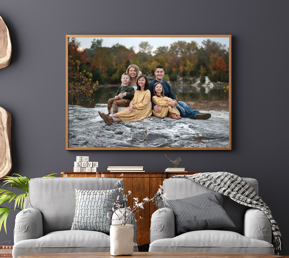 room with a large print on wall of a family at their family photo session in st. louis