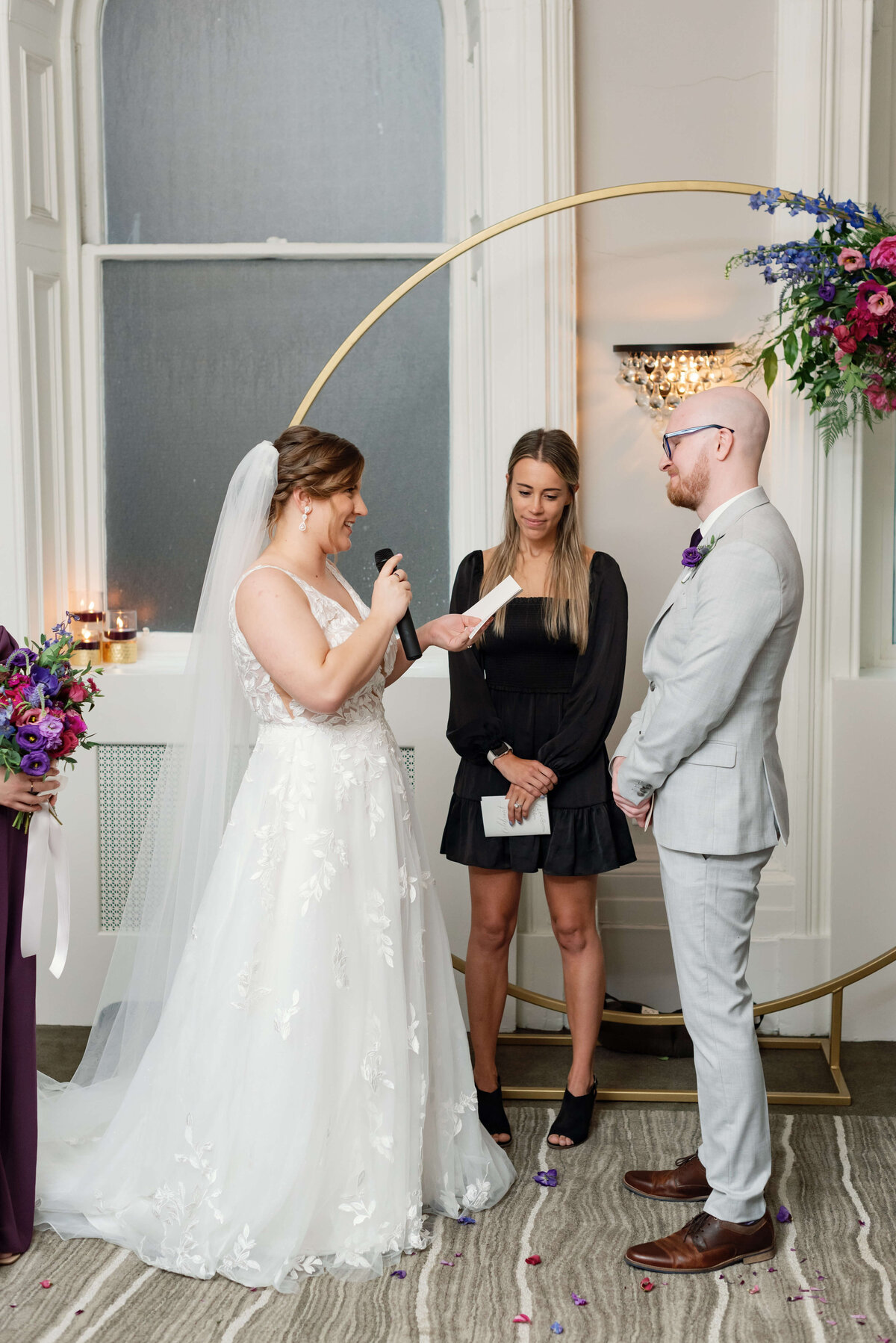 Bride reading vows to groom at  at Halifax Club wedding in Nova Scotia