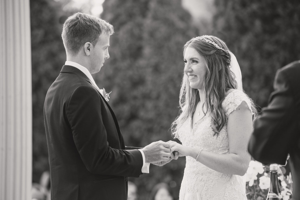 black and white wedding photo of bride and groom during ceremony at Willow Creek Golf and Country Club