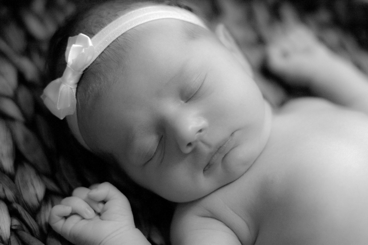 newborn baby wearing bow