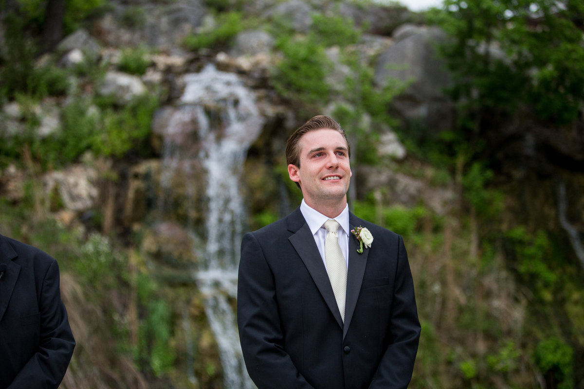 grooms reaction during first look as bride walks down aisle at Remi's Ridge at Hidden Falls  wedding venue