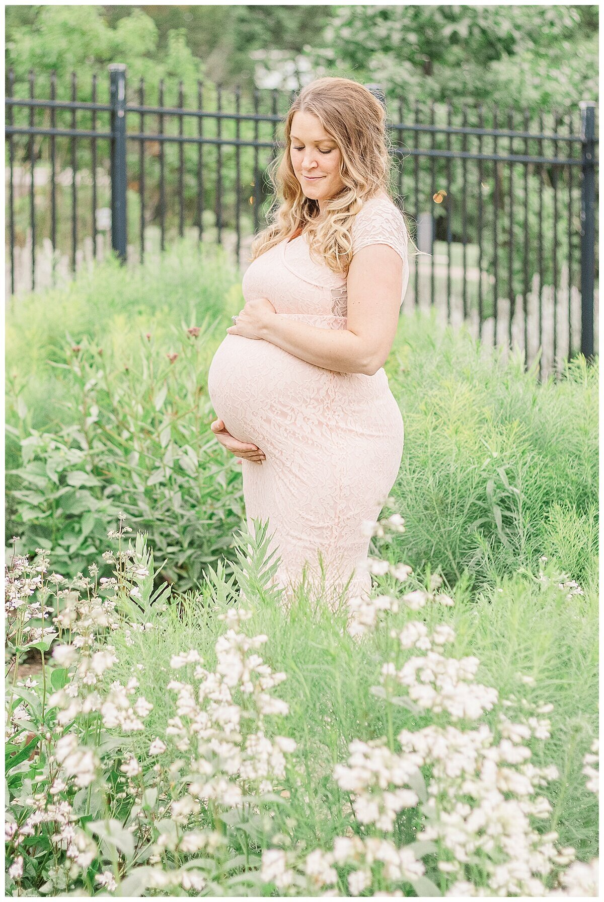 an outdoor Maternity Photography in Wexford where mom to be is surrounded by flowers.