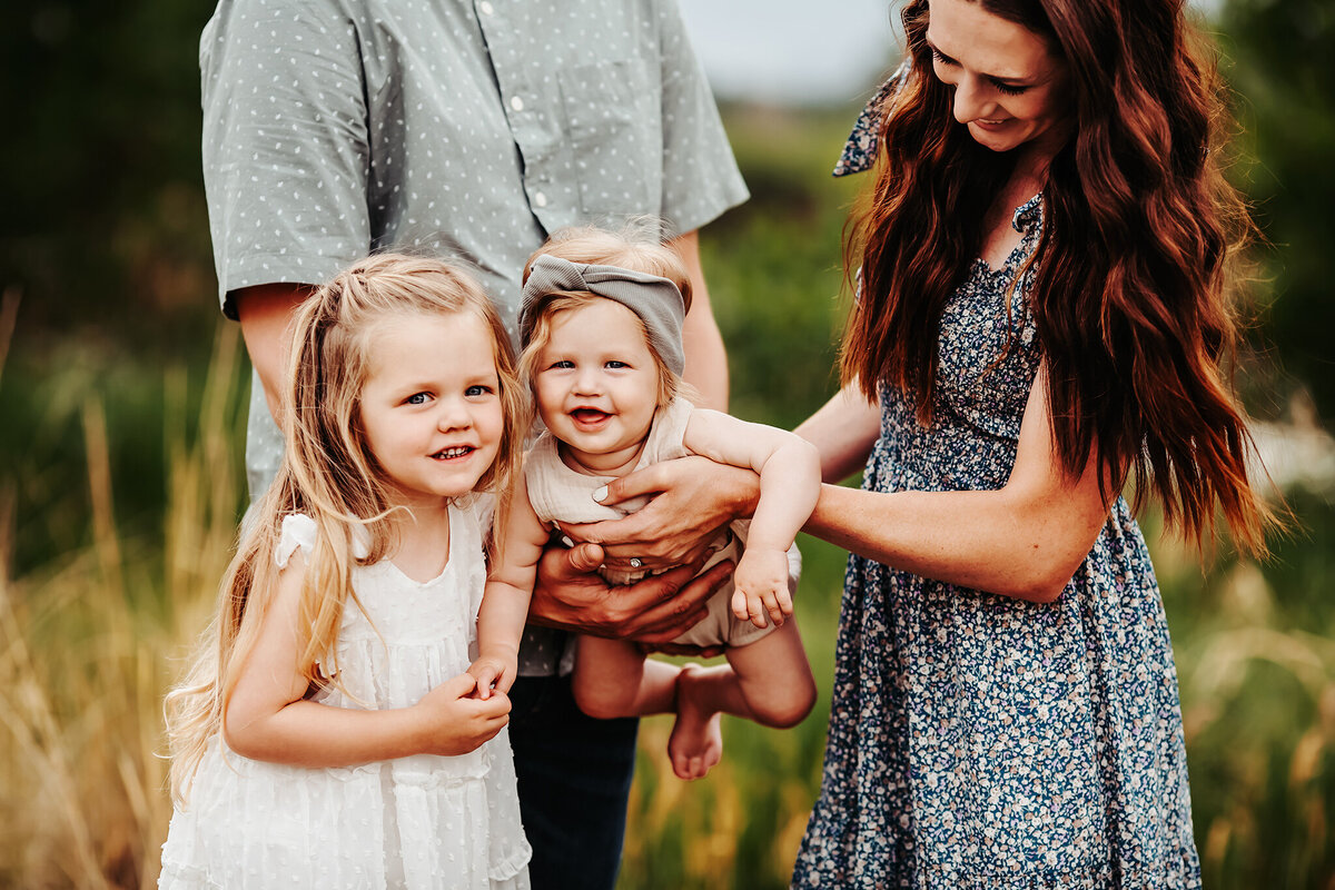 fun denver family photoshoot in a beautiful field in the summer