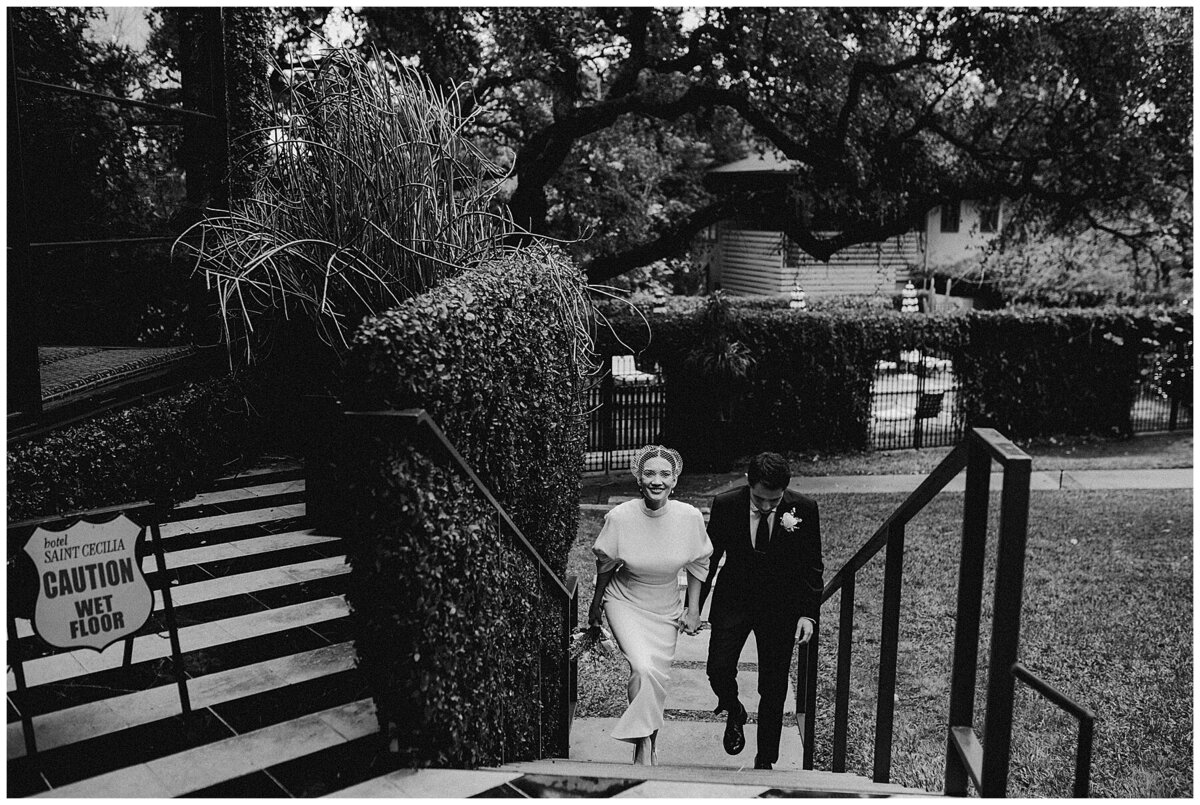 Bride and groom walking up the steps at Hotel Saint Cecilia Elopement Austin