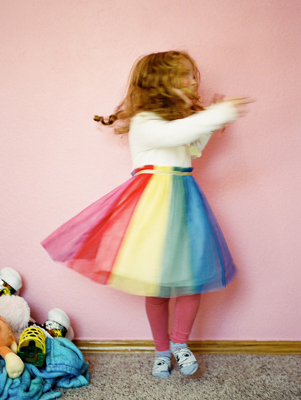 a girl in a tulle skirt spins
