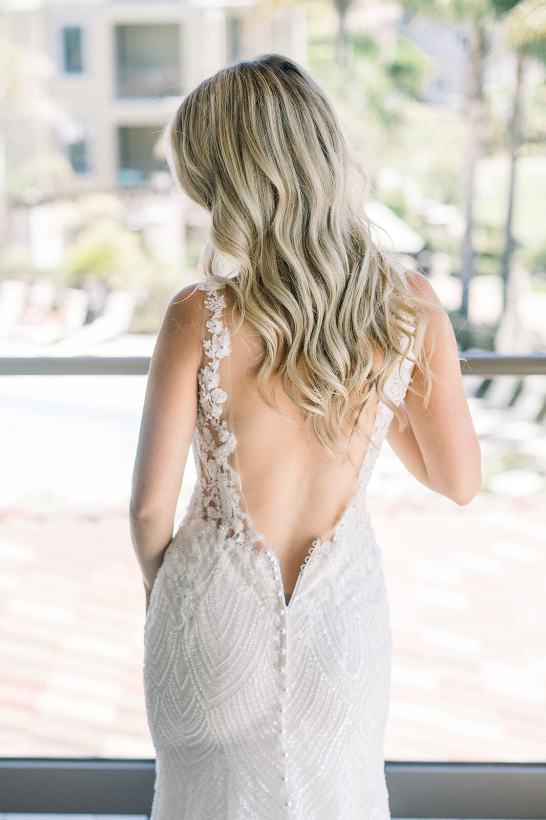 Brides backless wedding dress at Dolphin Bay Resort in Pismo Beach, CA