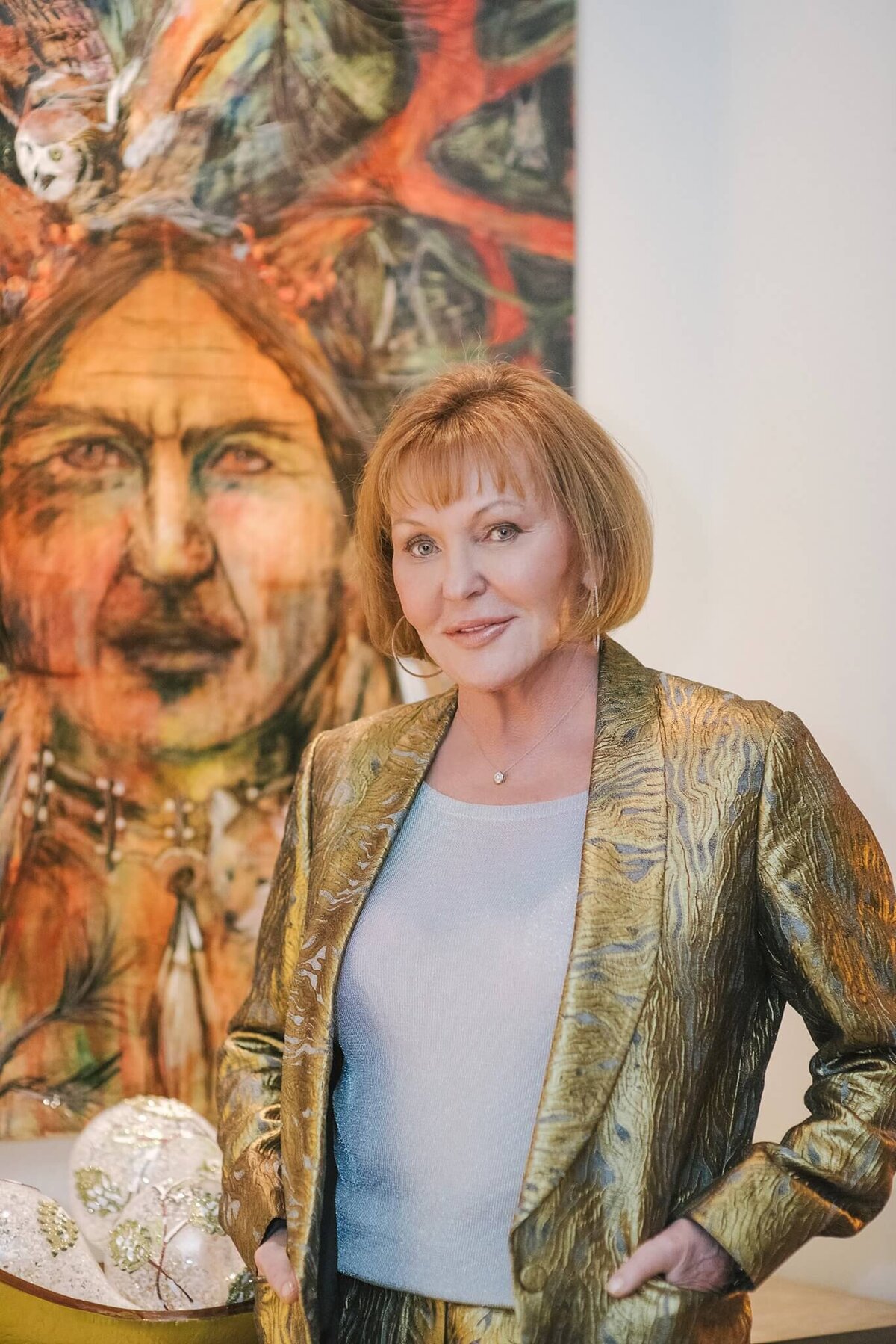 Lady in her living room in front of artwork in Reno , nevada