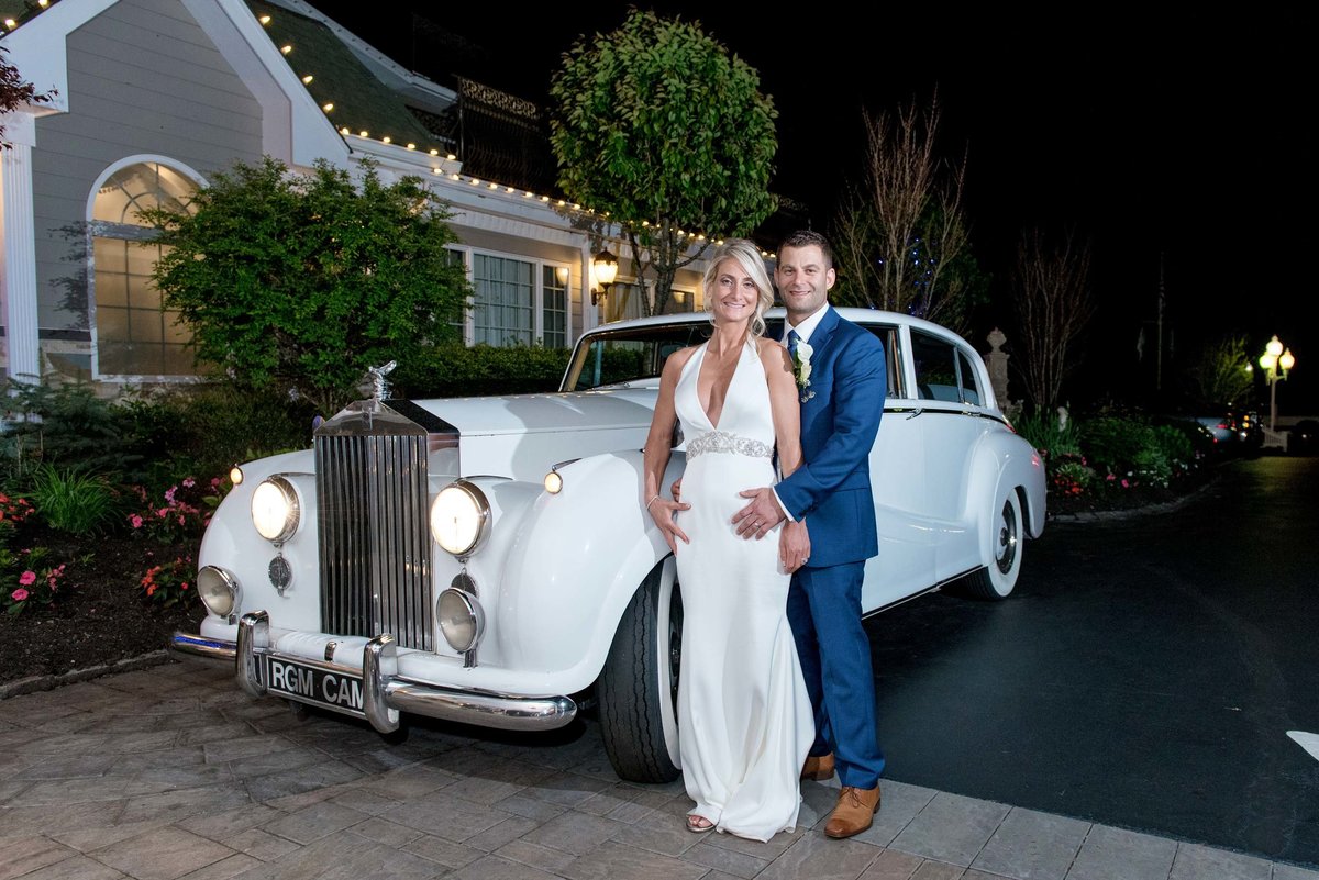 Bride and groom next to a vintage car Giorgio's Baiting Hollow