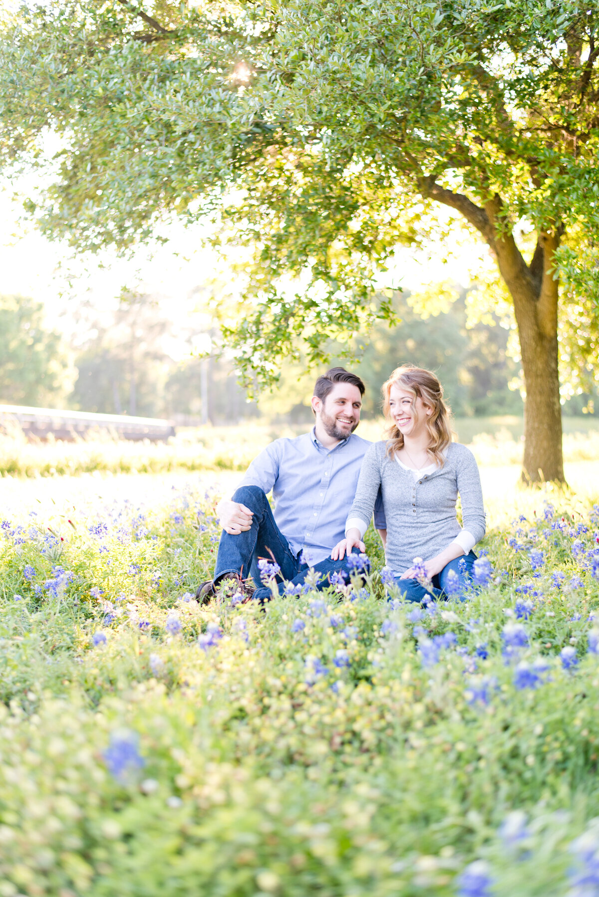 Fort Worth Engagement Photos of bride and groom in field