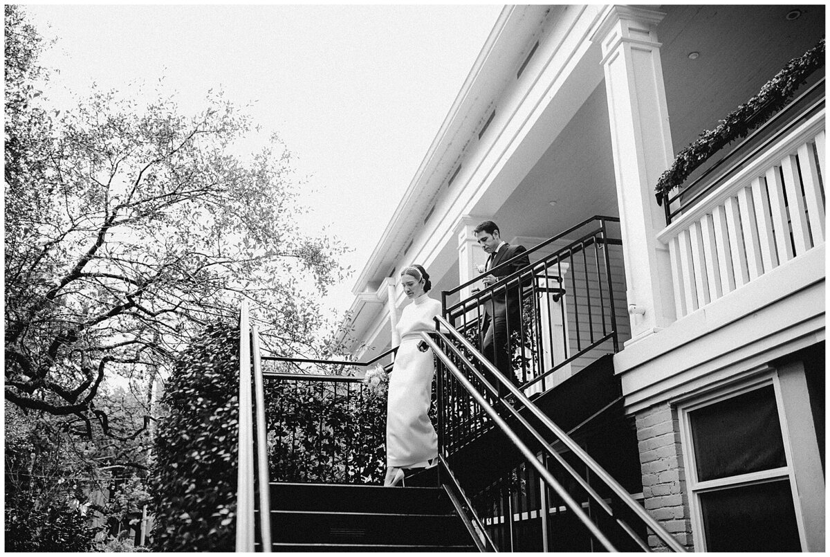 Bride standing at the top of some stairs at Hotel Cecilia AUstin