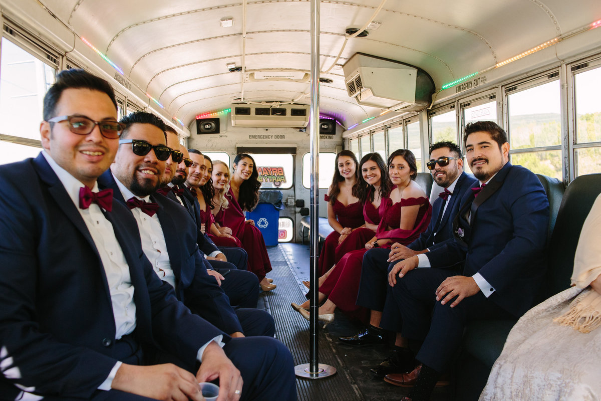 Bridal party ride party bus to ceremony as wedding transportation in hill country San Antonio at Oaks at Heavenly venue