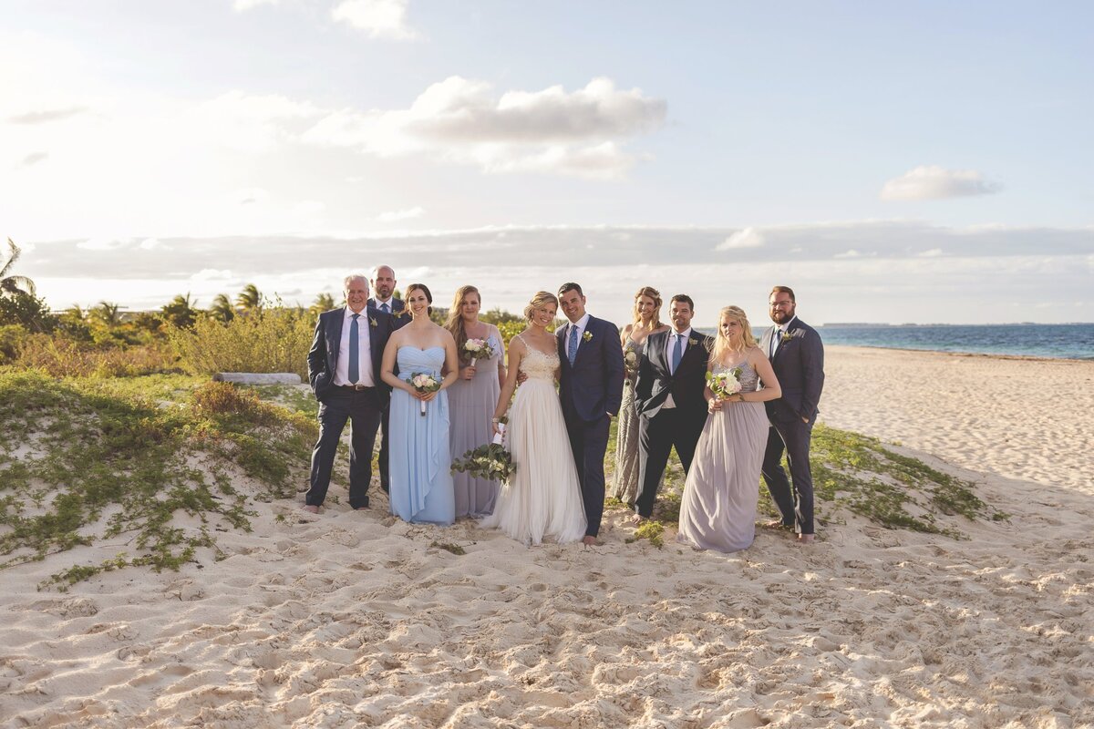 Portrait of bridal party on beach in Cancun