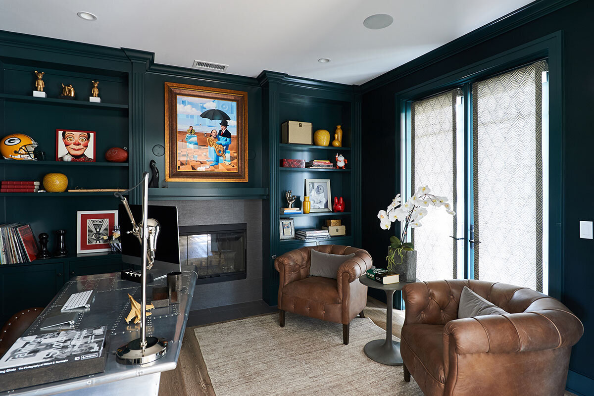 masculine office with dark green built ins